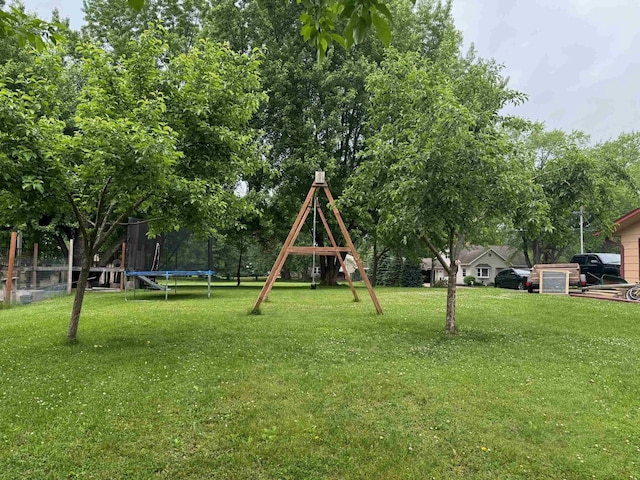710 Jefferson St, Merrill, WI 54452 - view of green lawn with a trampoline and a playground