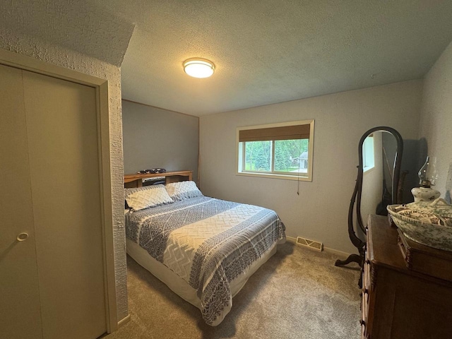 710 Jefferson St, Merrill, WI 54452 - carpeted bedroom featuring a textured ceiling and baseboards