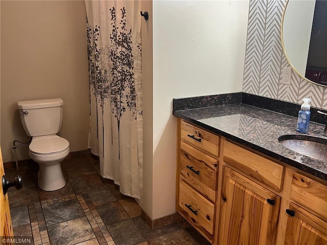 1283 230th Ave, Luck, WI 54853 - bathroom with vanity, stone finish floors, and wallpapered walls