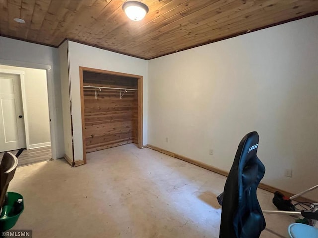 1283 230th Ave, Luck, WI 54853 - bedroom with wooden ceiling, concrete flooring, and a closet