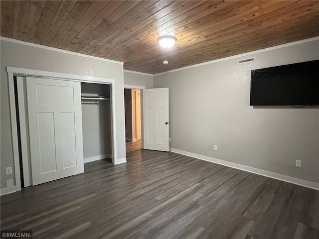 1283 230th Ave, Luck, WI 54853 - unfurnished bedroom with crown molding, wood ceiling, a closet, and dark wood finished floors