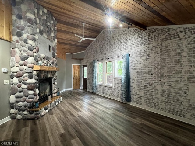 1283 230th Ave, Luck, WI 54853 - unfurnished living room with a stone fireplace, track lighting, wood ceiling, wood finished floors, and high vaulted ceiling