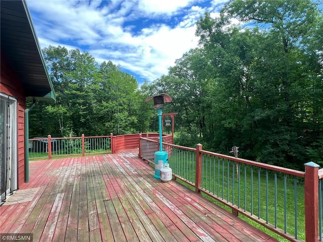1283 230th Ave, Luck, WI 54853 - wooden deck featuring a lawn