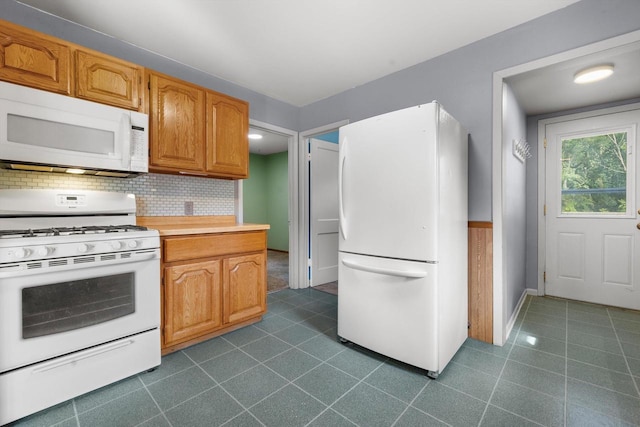 8020 Ridgeway Dr, Burlington, WI 53105 - kitchen featuring white appliances, dark tile patterned flooring, tasteful backsplash, and light countertops