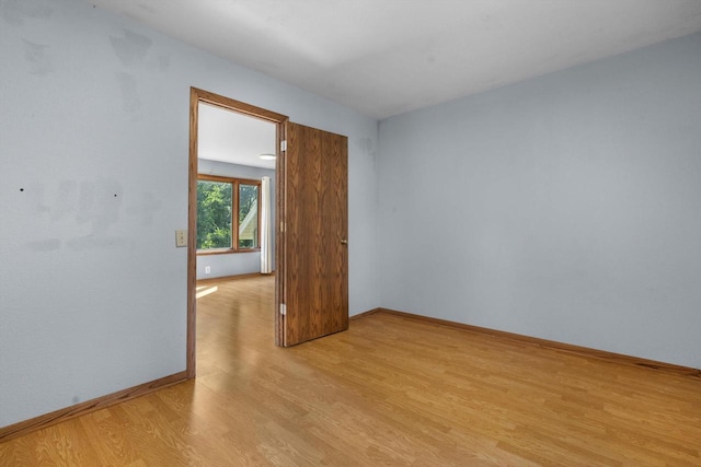 8020 Ridgeway Dr, Burlington, WI 53105 - unfurnished room with light wood-type flooring and baseboards