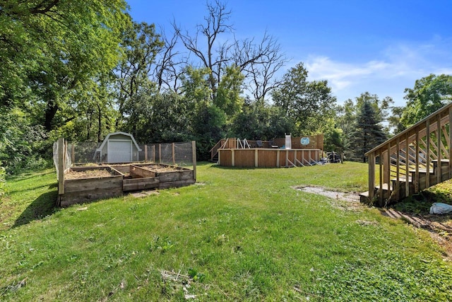 8020 Ridgeway Dr, Burlington, WI 53105 - view of grassy yard featuring a garden and stairs