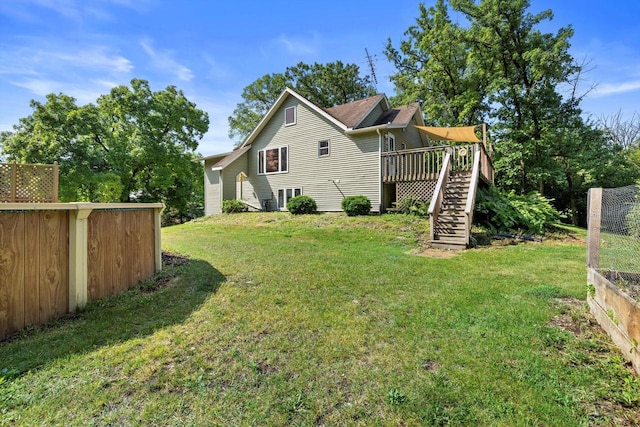 8020 Ridgeway Dr, Burlington, WI 53105 - rear view of property with stairs, a deck, and a yard