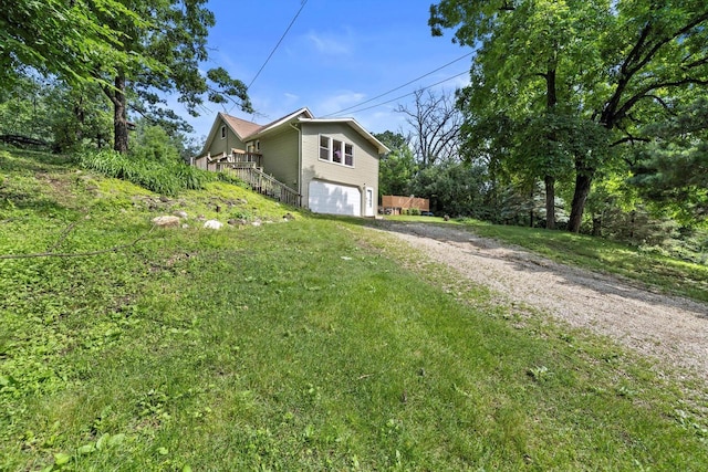 8020 Ridgeway Dr, Burlington, WI 53105 - view of property exterior with dirt driveway and an attached garage