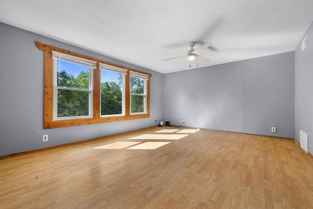 8020 Ridgeway Dr, Burlington, WI 53105 - unfurnished room featuring wood finished floors and a ceiling fan