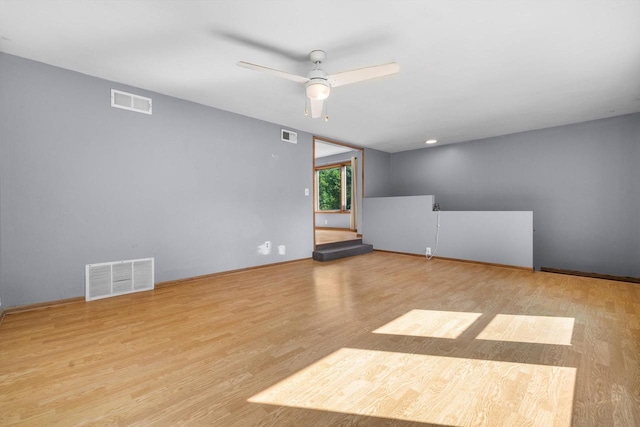 8020 Ridgeway Dr, Burlington, WI 53105 - empty room with ceiling fan and wood finished floors