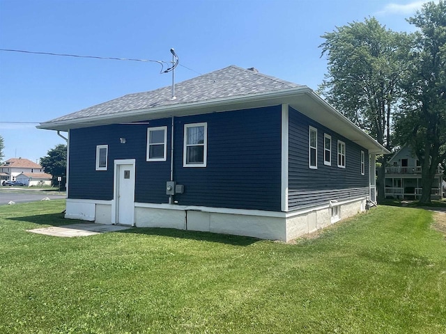 510 S Vine Ave, Marshfield, WI 54449 - back of house featuring a yard and roof with shingles