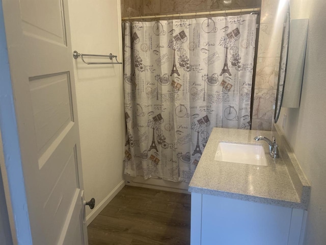 510 S Vine Ave, Marshfield, WI 54449 - full bathroom featuring vanity and wood finished floors