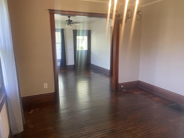 510 S Vine Ave, Marshfield, WI 54449 - spare room with dark wood-type flooring and a chandelier