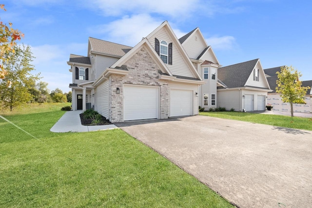 1883 Woodland Way, Slinger, WI 53086 - view of front of property with driveway, a garage, a front lawn, brick siding, and roof with shingles