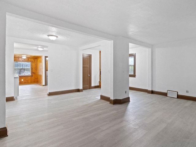 5751 N 38th St, Milwaukee, WI 53209 - unfurnished living room with light wood-style floors and plenty of natural light