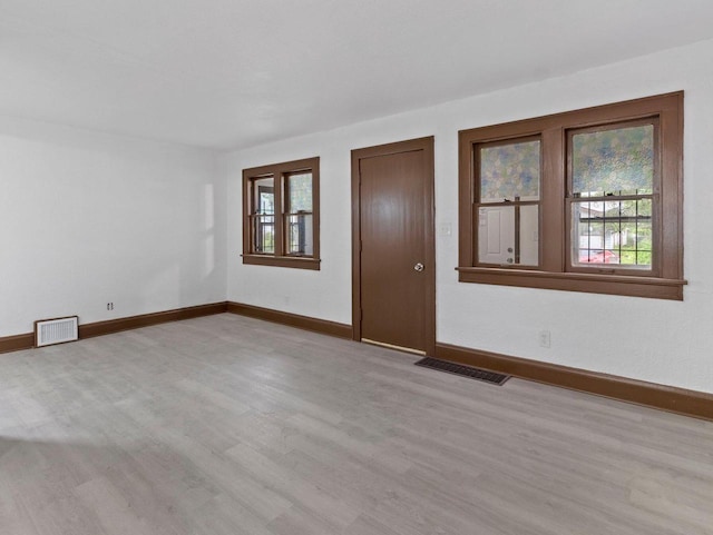 5751 N 38th St, Milwaukee, WI 53209 - unfurnished room with healthy amount of natural light and light wood-style floors