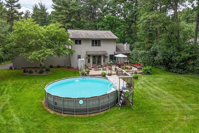 5111 Timberland Trl, Wisconsin Rapids, WI 54494 - back of house featuring a deck, a yard, and an outdoor pool