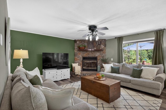 5111 Timberland Trl, Wisconsin Rapids, WI 54494 - living area featuring light wood-style floors, ceiling fan, and a fireplace