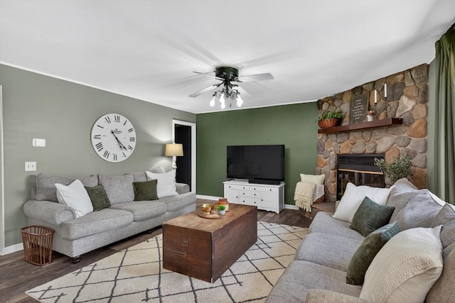 5111 Timberland Trl, Wisconsin Rapids, WI 54494 - living room featuring light wood-style flooring, a ceiling fan, and a stone fireplace