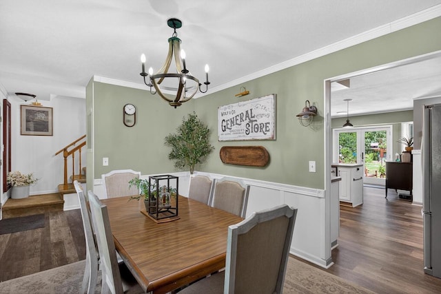 5111 Timberland Trl, Wisconsin Rapids, WI 54494 - dining room with a chandelier, dark wood-style flooring, stairway, and crown molding