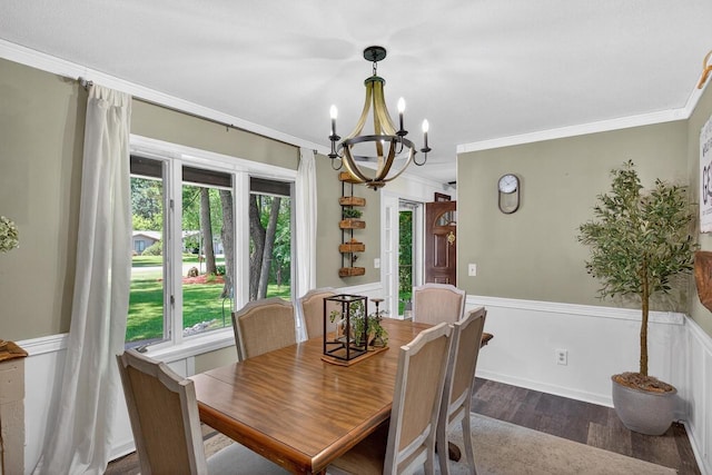 5111 Timberland Trl, Wisconsin Rapids, WI 54494 - dining room featuring a chandelier, dark wood finished floors, ornamental molding, and a wainscoted wall