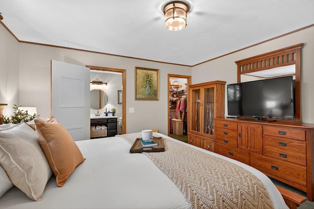 5111 Timberland Trl, Wisconsin Rapids, WI 54494 - bedroom featuring crown molding, a spacious closet, a closet, and ensuite bath