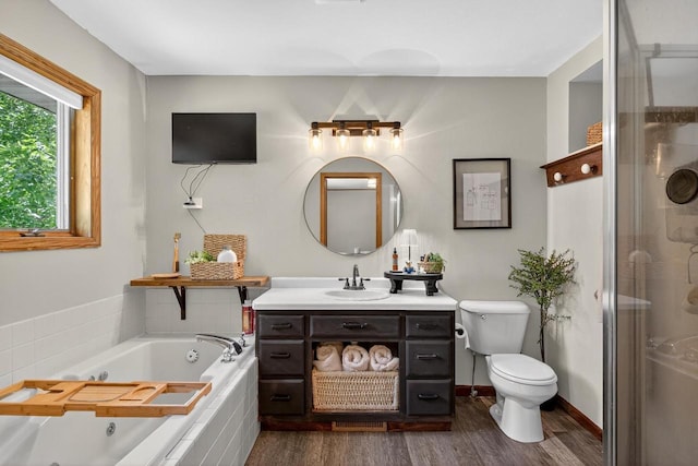 5111 Timberland Trl, Wisconsin Rapids, WI 54494 - bathroom with vanity, wood finished floors, a tub with jets, and a shower stall