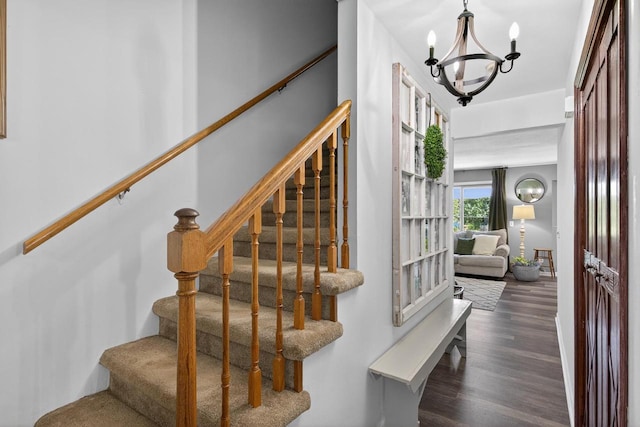 5111 Timberland Trl, Wisconsin Rapids, WI 54494 - staircase featuring a chandelier and wood finished floors