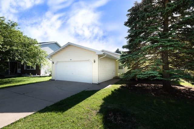 851 Hennessy St, Oshkosh, WI 54904 - view of property exterior with a garage, driveway, and a yard