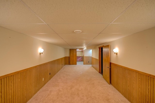 851 Hennessy St, Oshkosh, WI 54904 - hall featuring wainscoting, a drop ceiling, carpet flooring, and wooden walls