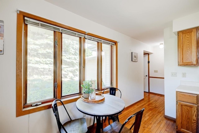851 Hennessy St, Oshkosh, WI 54904 - dining area with light wood-style flooring and baseboards