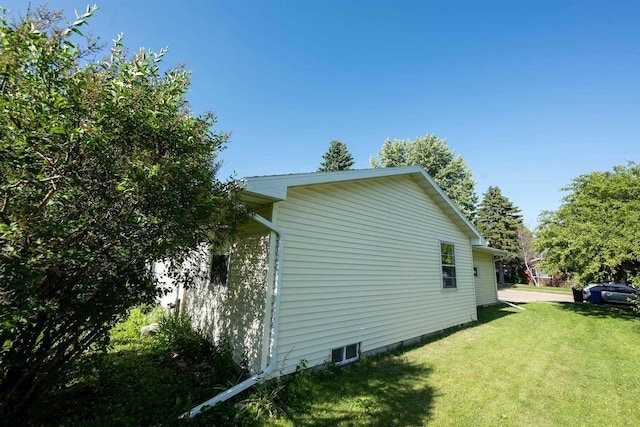 851 Hennessy St, Oshkosh, WI 54904 - view of side of property with a lawn