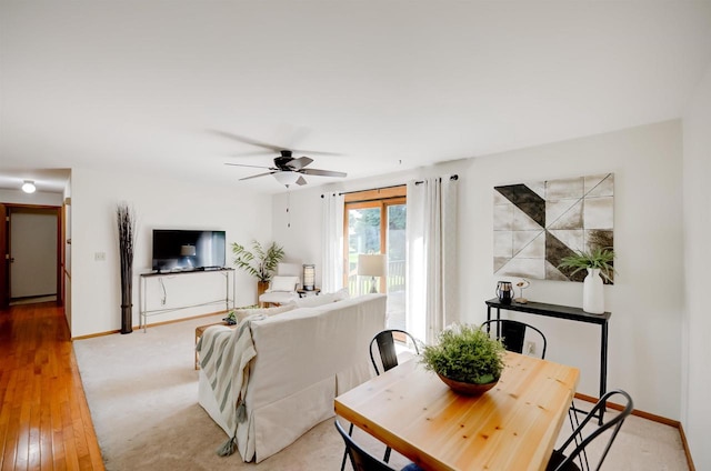 851 Hennessy St, Oshkosh, WI 54904 - dining room featuring a ceiling fan and light wood-style flooring