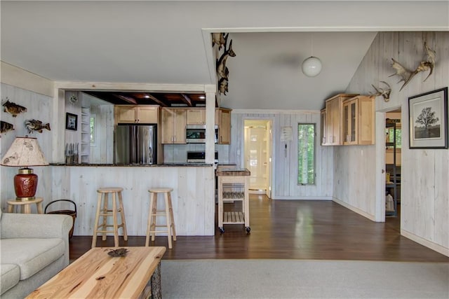 8674 Nor Wis Rd, Hayward, WI 54843 - kitchen with stainless steel appliances, glass insert cabinets, a kitchen breakfast bar, dark wood-type flooring, and a peninsula