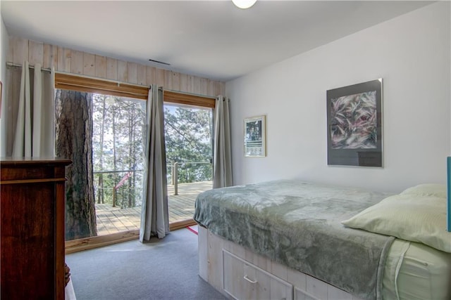 8674 Nor Wis Rd, Hayward, WI 54843 - bedroom with light colored carpet and access to outside