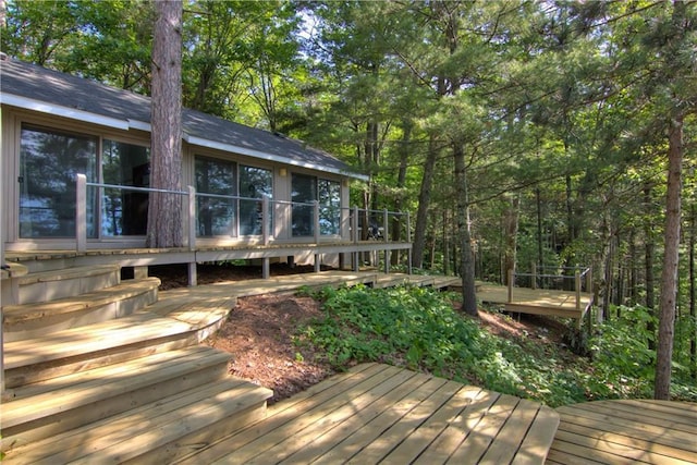8674 Nor Wis Rd, Hayward, WI 54843 - deck featuring a sunroom