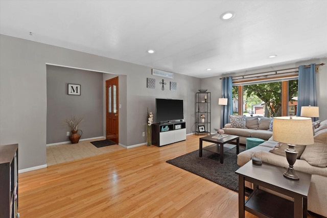 6196 N River Trail Dr, Milwaukee, WI 53225 - living room with light wood finished floors and recessed lighting