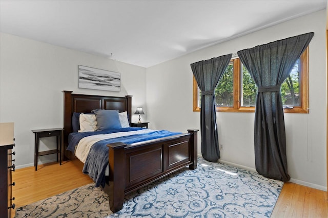 6196 N River Trail Dr, Milwaukee, WI 53225 - bedroom featuring light wood finished floors and baseboards
