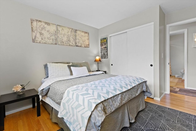 6196 N River Trail Dr, Milwaukee, WI 53225 - bedroom with wood finished floors and a closet