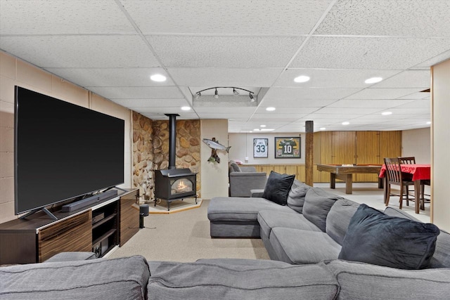 6196 N River Trail Dr, Milwaukee, WI 53225 - living room with a paneled ceiling, a wood stove, carpet flooring, and recessed lighting