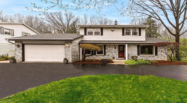 10500 W Good Hope Rd, Milwaukee, WI 53224 - traditional-style home with a garage, driveway, a chimney, covered porch, and a front yard