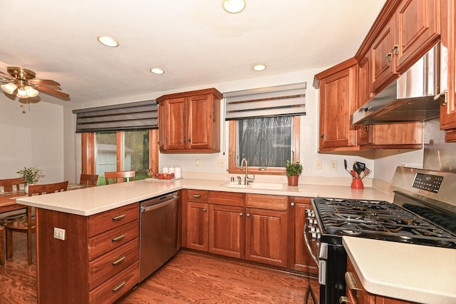 10500 W Good Hope Rd, Milwaukee, WI 53224 - kitchen featuring stainless steel appliances, a peninsula, ceiling fan, recessed lighting, and light countertops