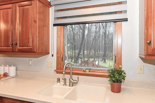 10500 W Good Hope Rd, Milwaukee, WI 53224 - kitchen featuring light countertops and brown cabinetry