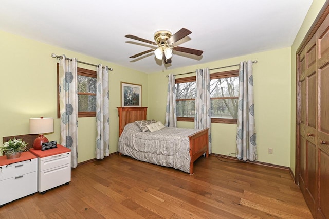 10500 W Good Hope Rd, Milwaukee, WI 53224 - bedroom featuring light wood finished floors, multiple windows, and a ceiling fan