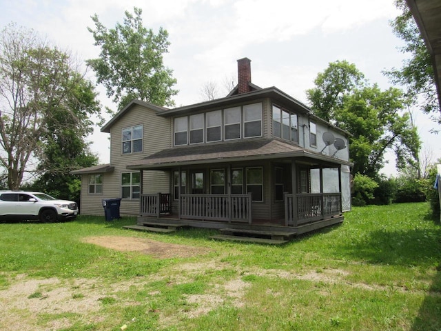 N3901 State Road 76, Hortonville, WI 54944 - rear view of house with covered porch, a yard, and a chimney