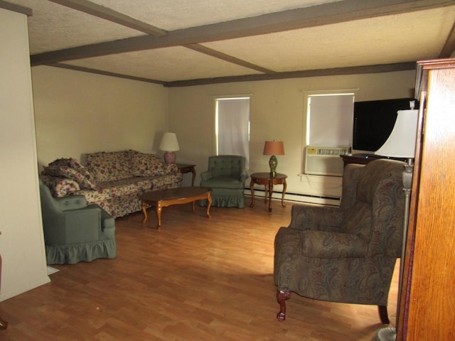 N3901 State Road 76, Hortonville, WI 54944 - living room featuring beam ceiling, cooling unit, baseboard heating, wood finished floors, and a textured ceiling