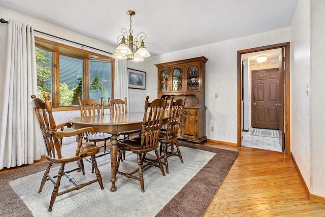 1334 W Cloverdale Dr, Appleton, WI 54914 - dining room featuring light wood-style floors and a chandelier