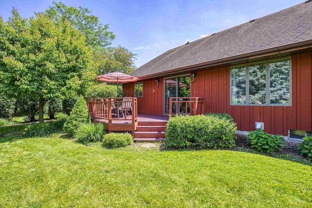 1334 W Cloverdale Dr, Appleton, WI 54914 - back of house featuring a deck, a yard, roof with shingles, and board and batten siding