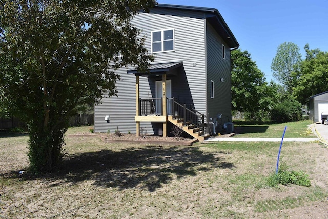 120 Eleonor St, Two Rivers, WI 54241 - rear view of property featuring a yard