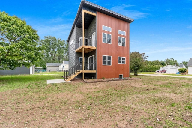 120 Eleonor St, Two Rivers, WI 54241 - back of property featuring a balcony and a yard